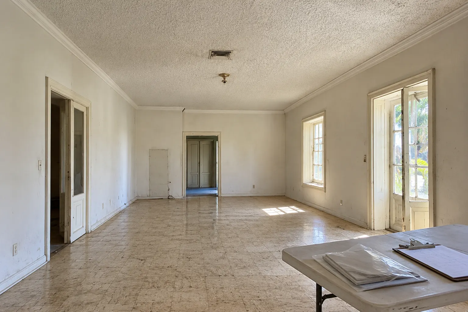 Popcorn ceiling and old floor tiles in a 1960s Miami house