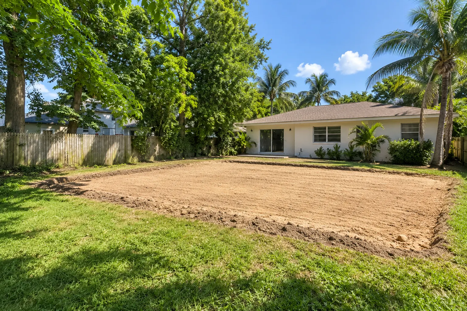 Backyard filled and graded after a pool removal in Miami